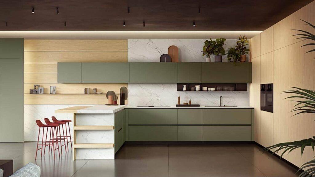 a kitchen with green cabinets and a stool