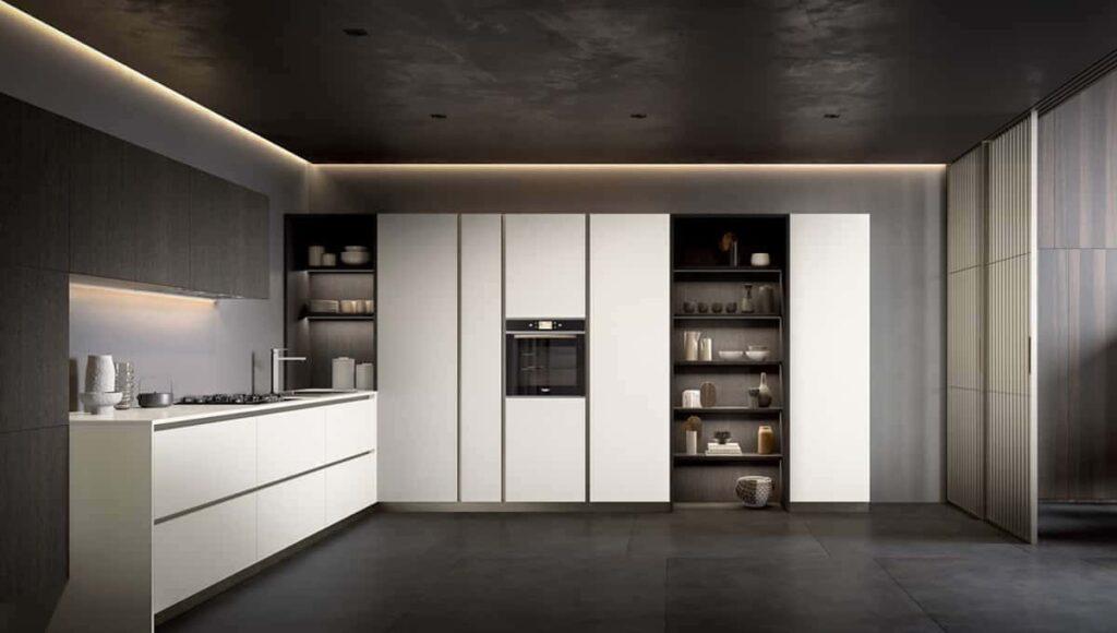 a kitchen with white cabinets and shelves