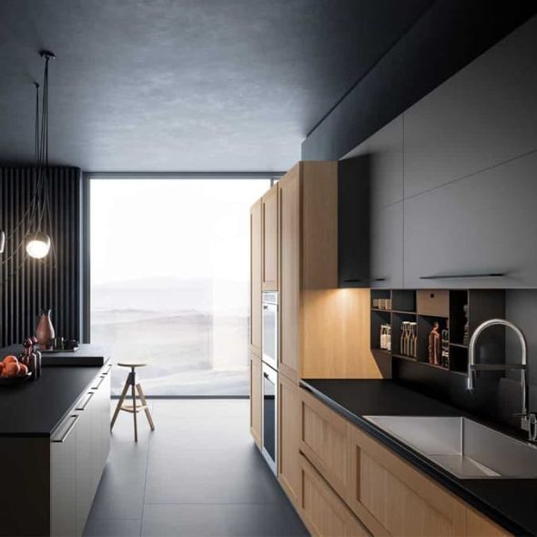 a kitchen with a black countertop and a stool