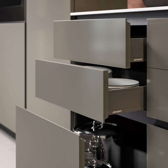 a kitchen cabinet with drawers