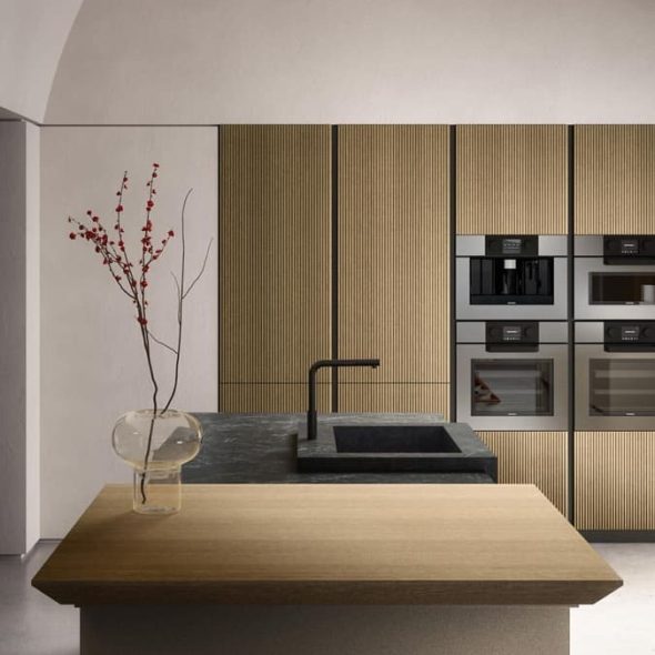 a kitchen with a wood countertop and a sink