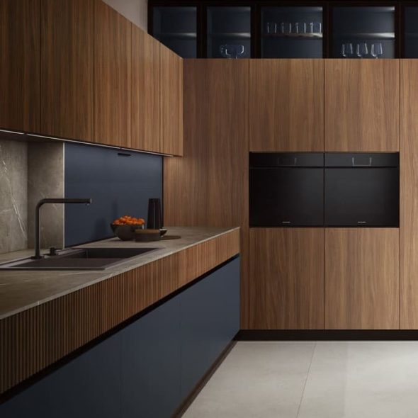 a kitchen with wood cabinets and a sink