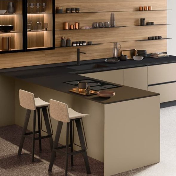 a kitchen with a black countertop and stools