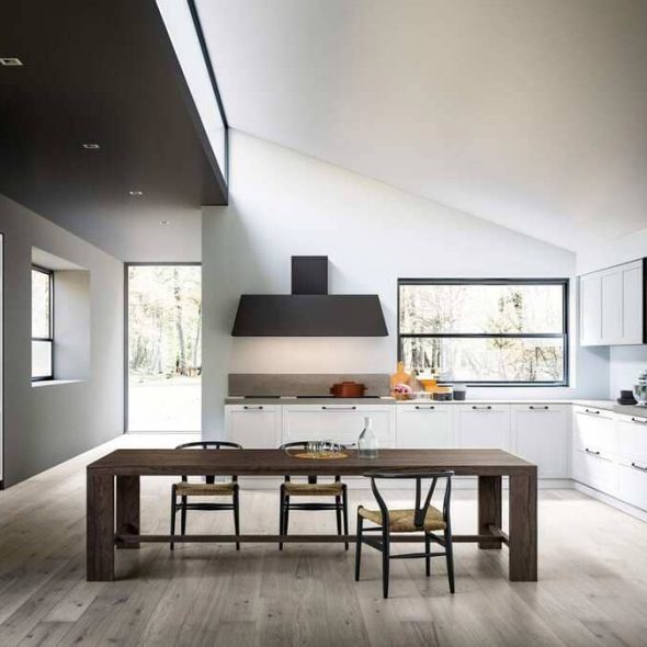 a kitchen with a table and chairs